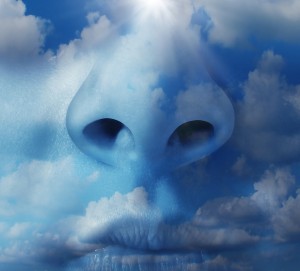 Artistic image of face in sky with sunlight shining